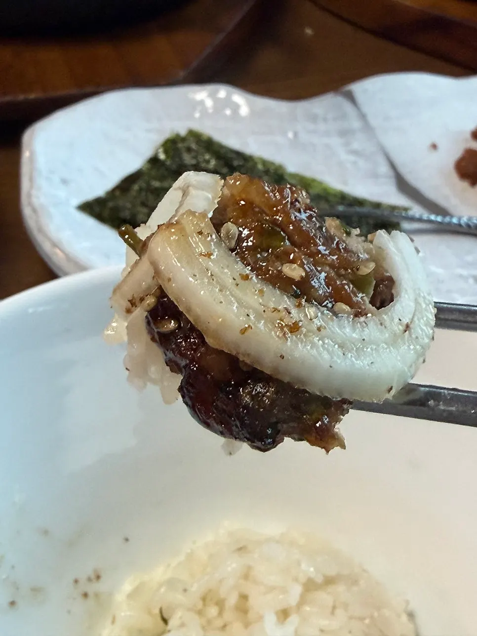A piece of minari tteokgalbi with rice