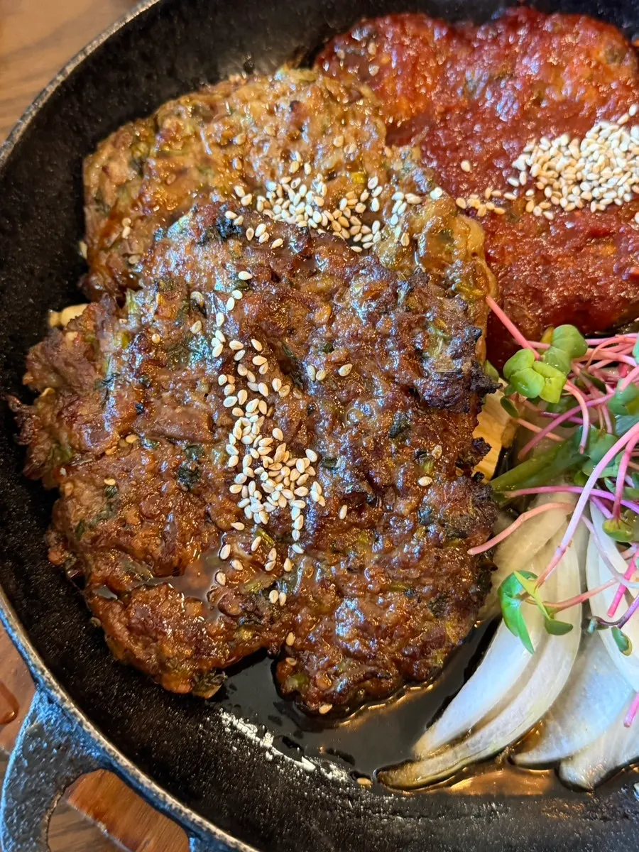 Table set with three types of tteokgalbi for three diners