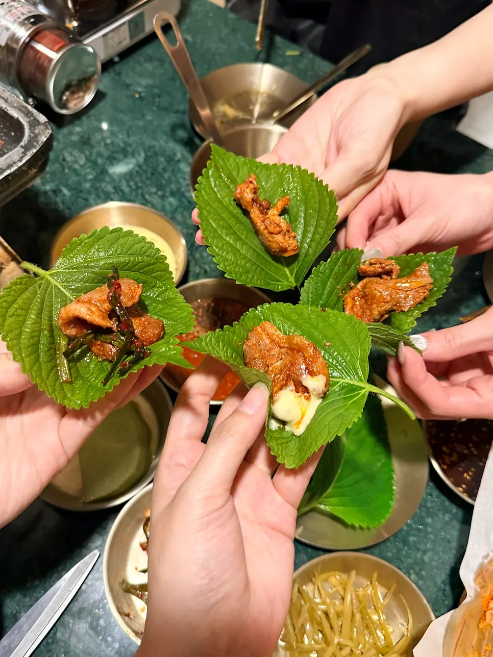 Duck roast topped with minari and dipped in sauce