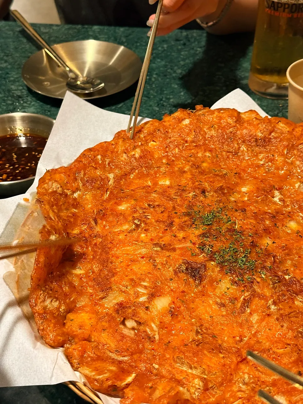 Cross-section of a torn-off piece of kimchi pancake
