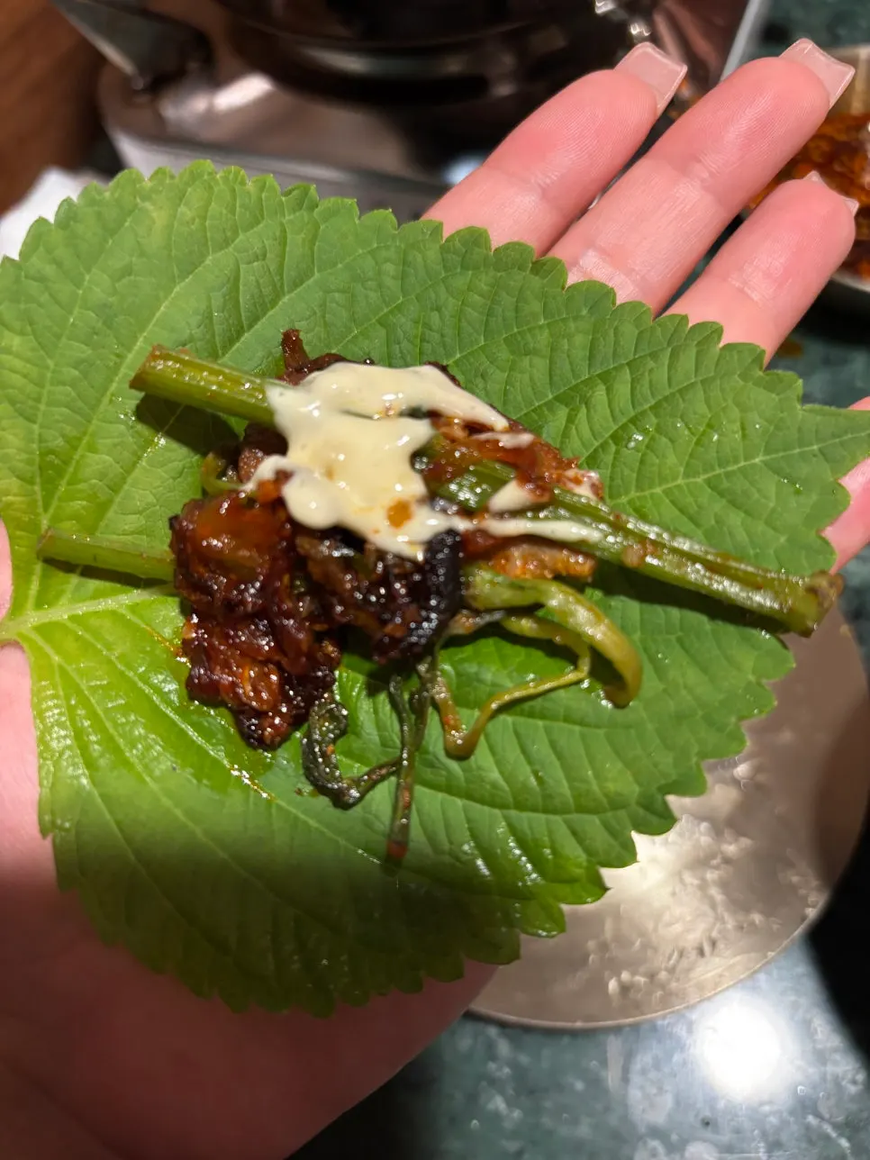 Roast duck wrapped with perilla leaf and pickled radish