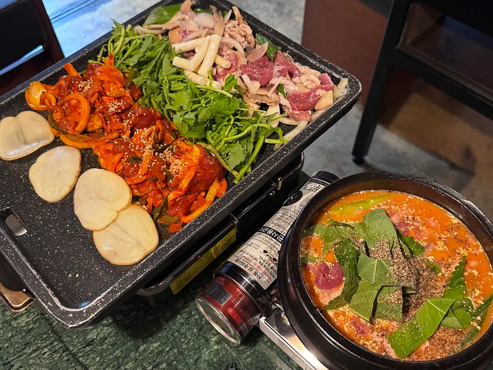 Side dishes including radish pickles, perilla leaves, and green onion kimchi