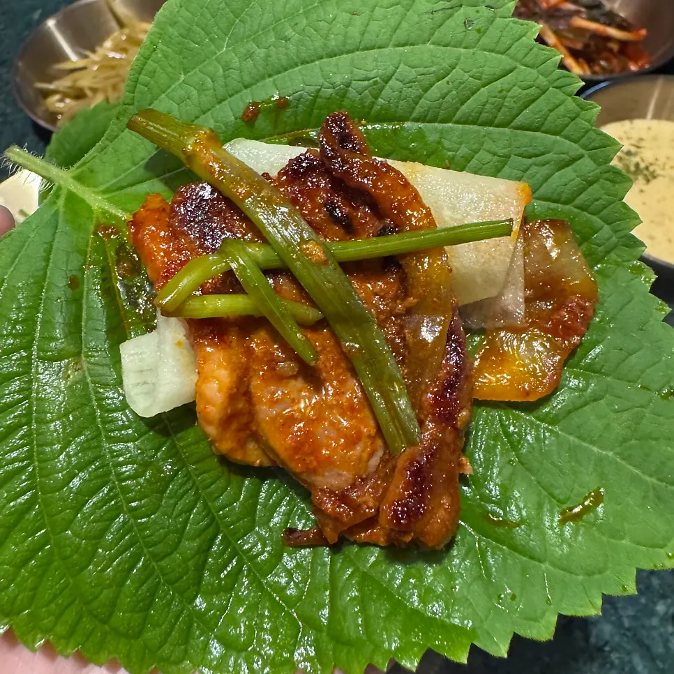 A piece of richly seasoned duck bulgalbi