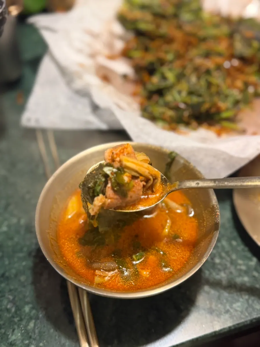 Duck stew broth with a bowl of rice