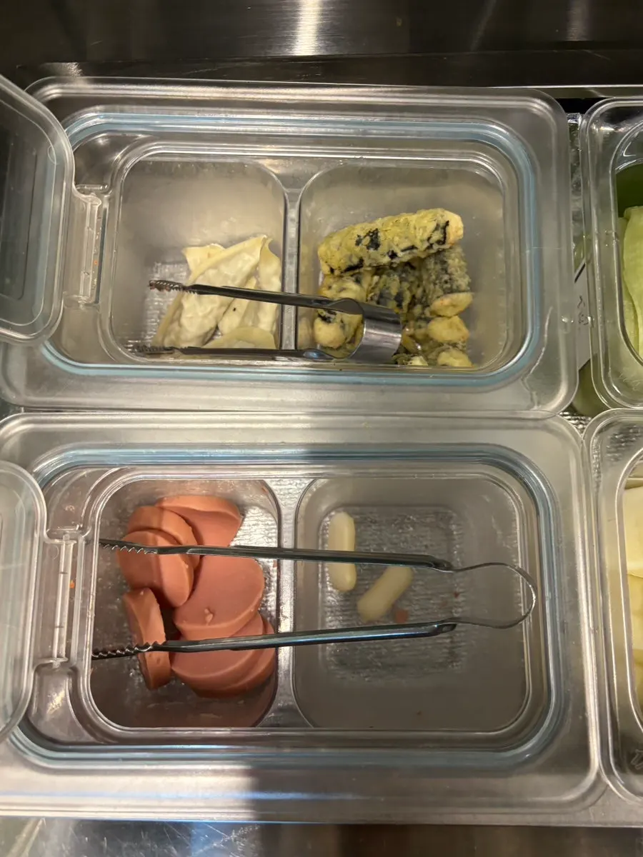 Sauces displayed at the self-serve corner, including the all-purpose sauce