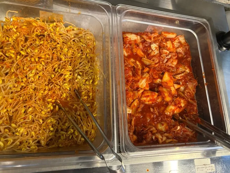 Self-serve buffet corner stocked with thinly sliced pork