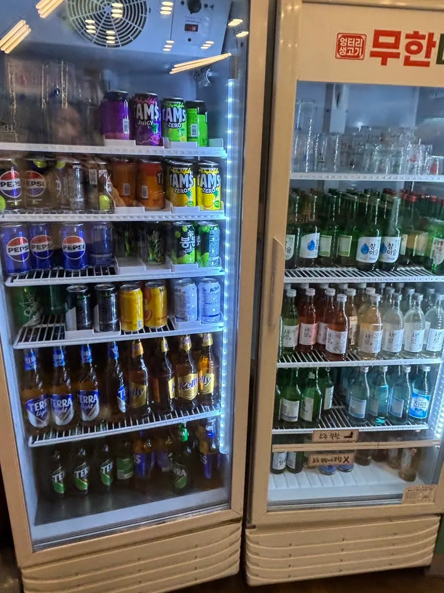 Self-serve fridge with water and alcohol