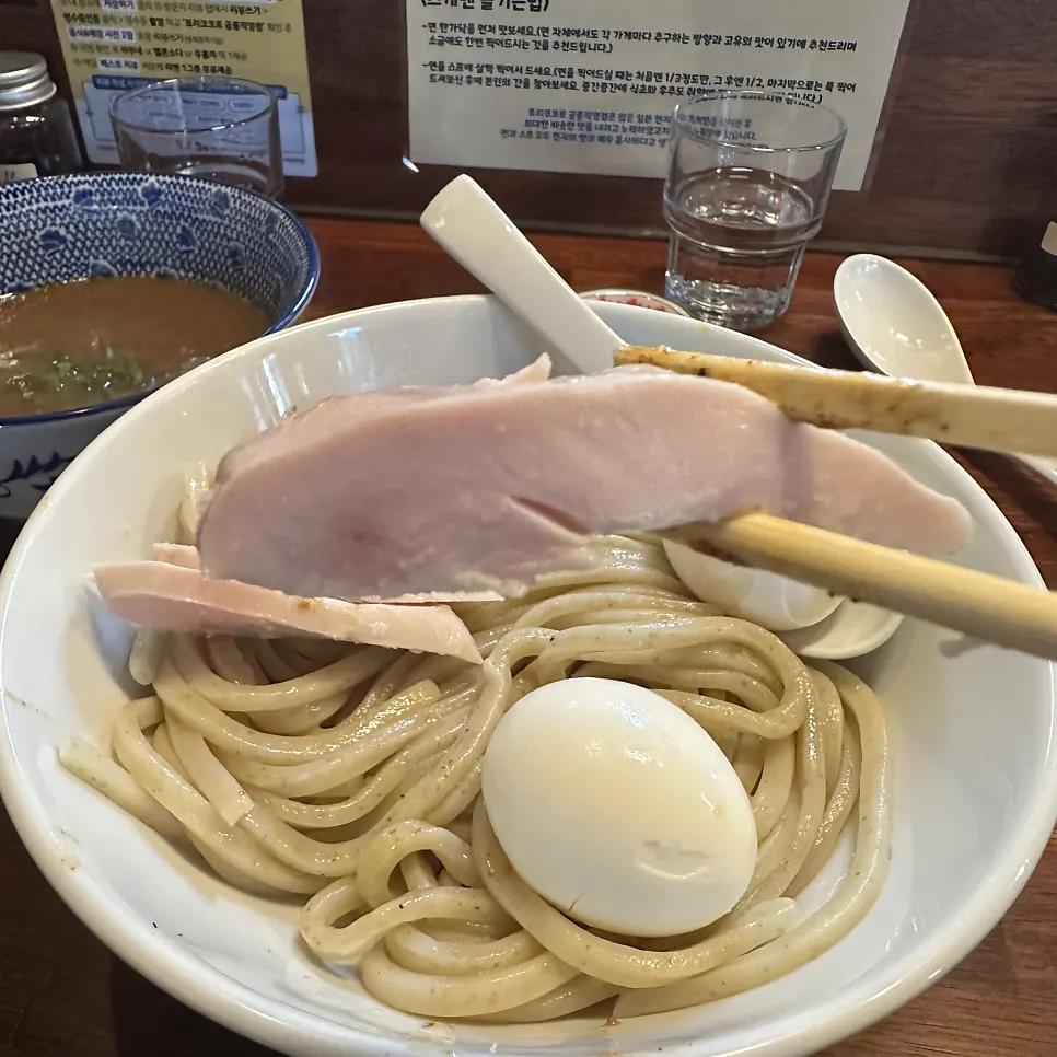 Egg and chicken breast toppings added to tsukemen