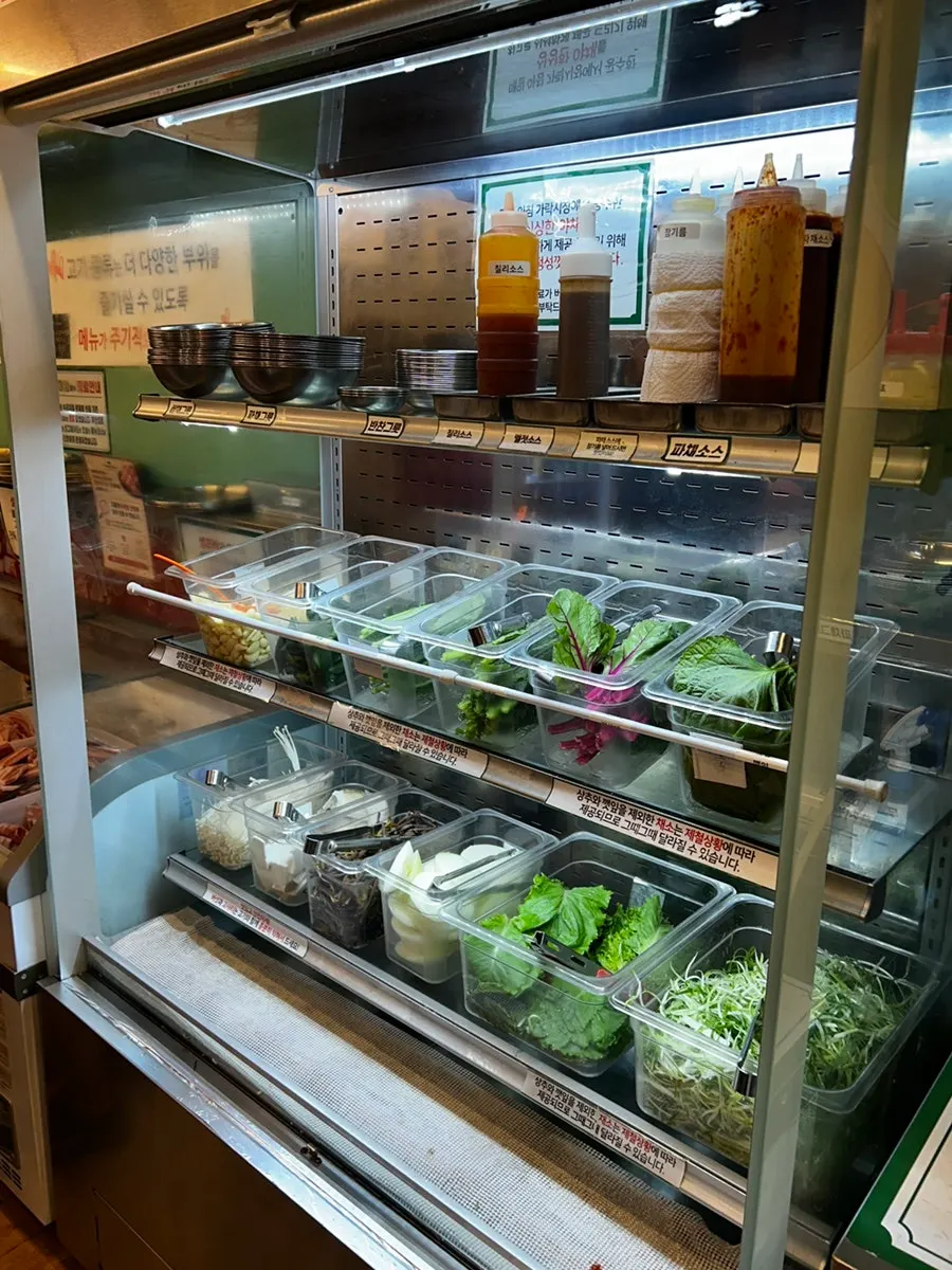 Self-serve corner with various types of meat on display