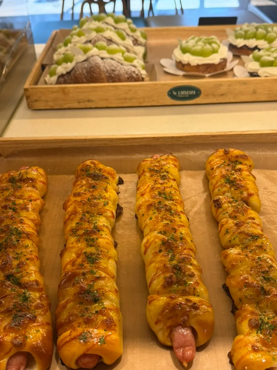 Bakery counter full of glossy breads