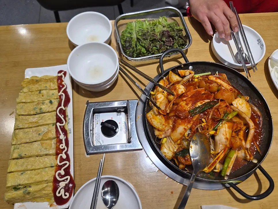 Giant rolled omelet served with duruchigi
