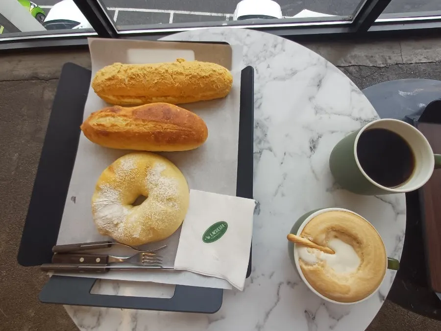 Table setting with La Cuesta coffee and bakery items