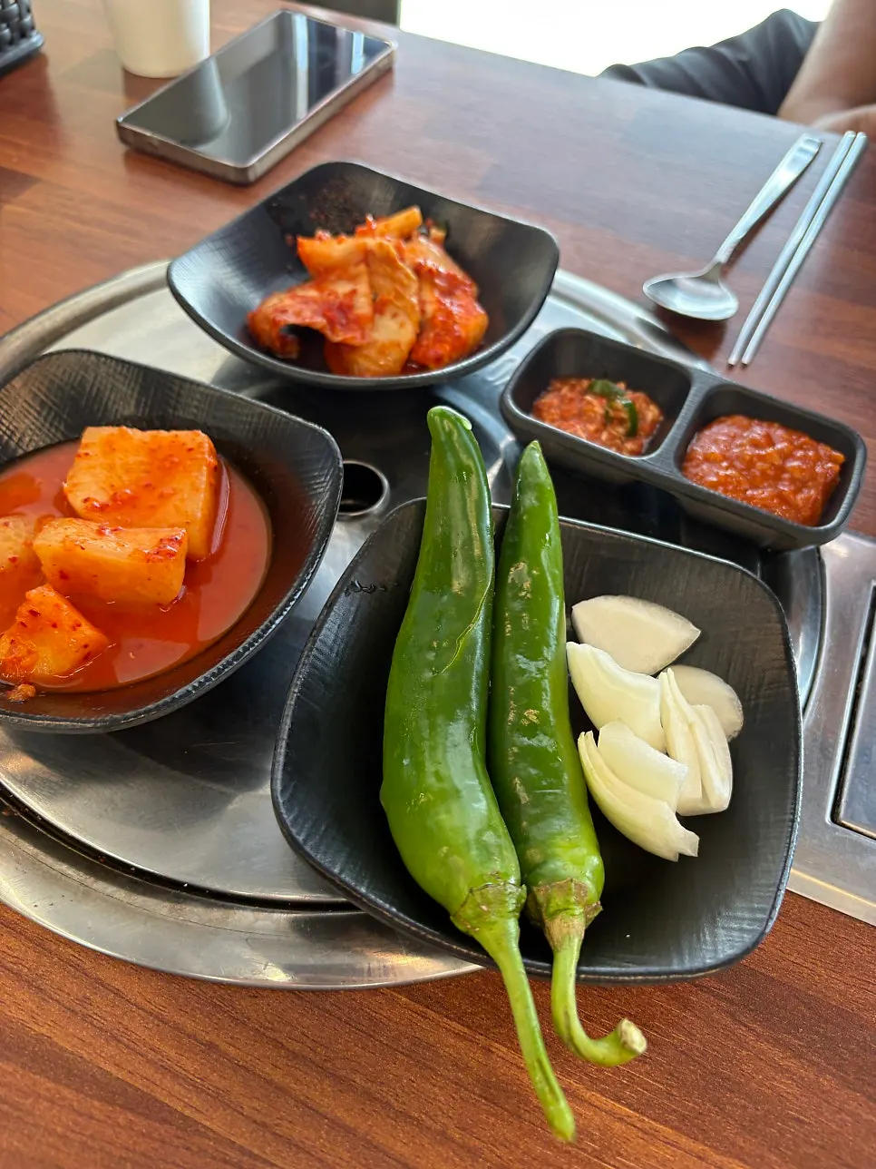 Kimchi and side dishes taken from the self-service corner
