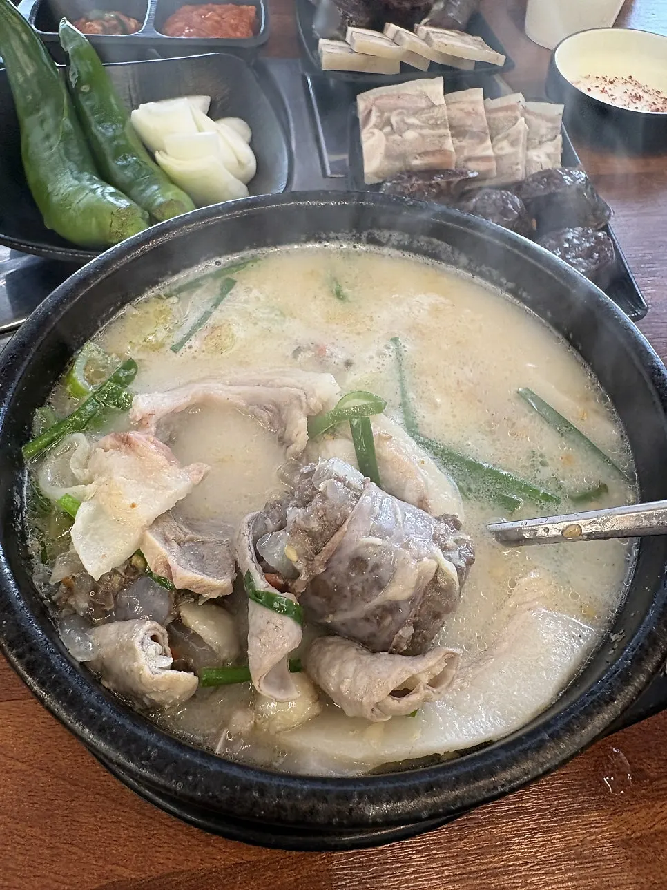A spoonful of sundaeguk ingredients lifted from the pot