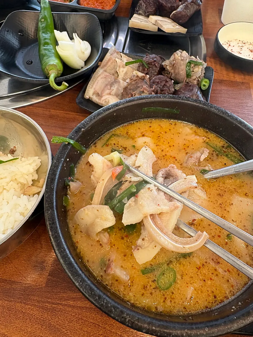 A full spread of sundaeguk eaten with rice