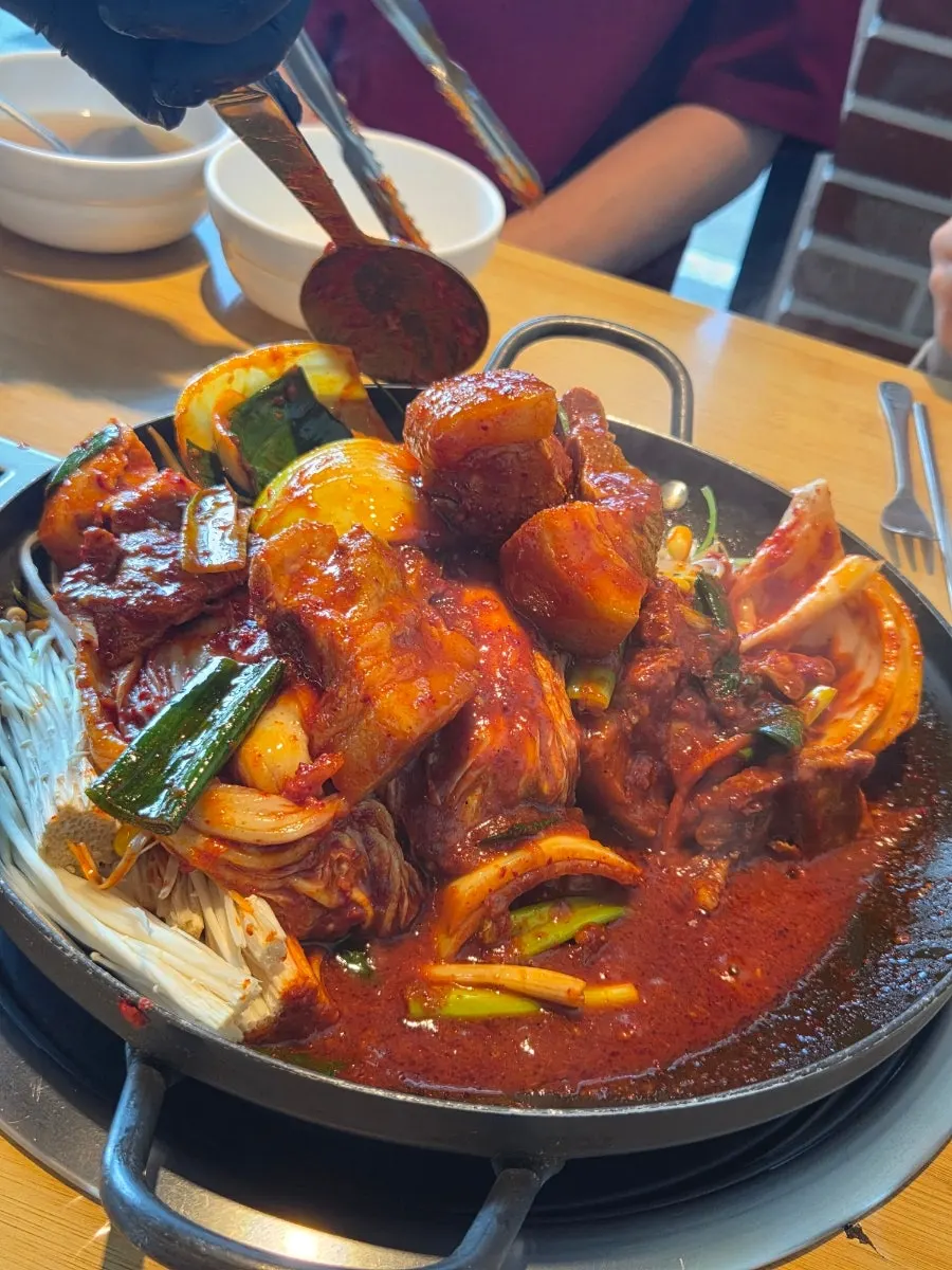 Seasoned pork packed underneath the vegetables