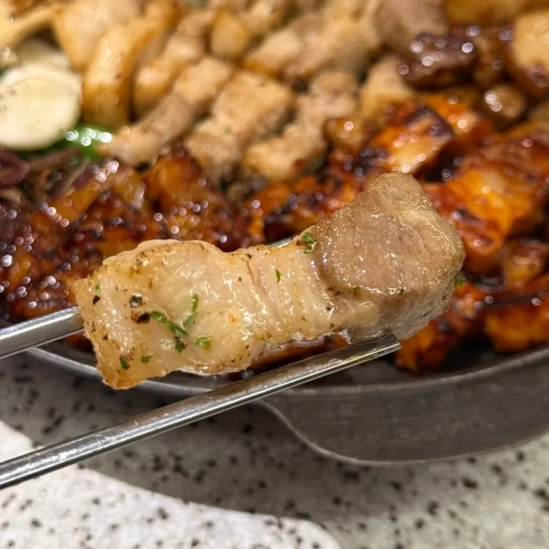Pork belly and vegetables on the grill