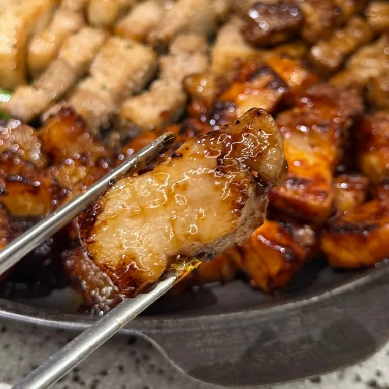 Pork belly eaten wrapped in lettuce