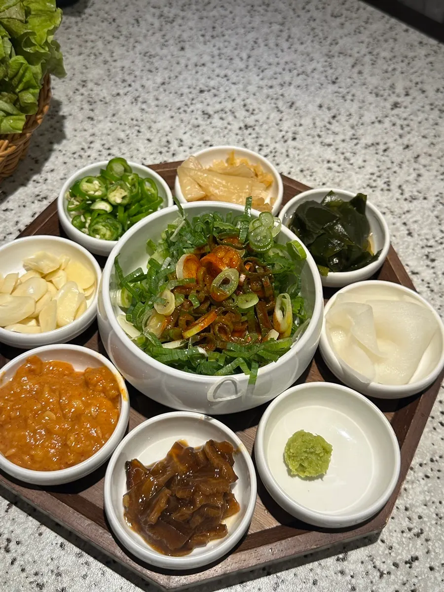 Basic table setting plate with potato slices and myeongi namul
