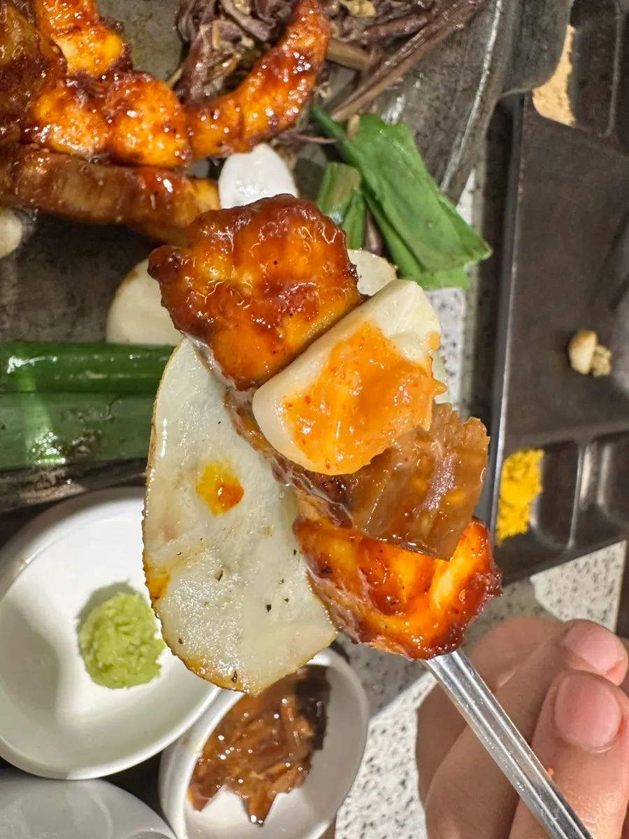 A potato slice topped with myeongi namul