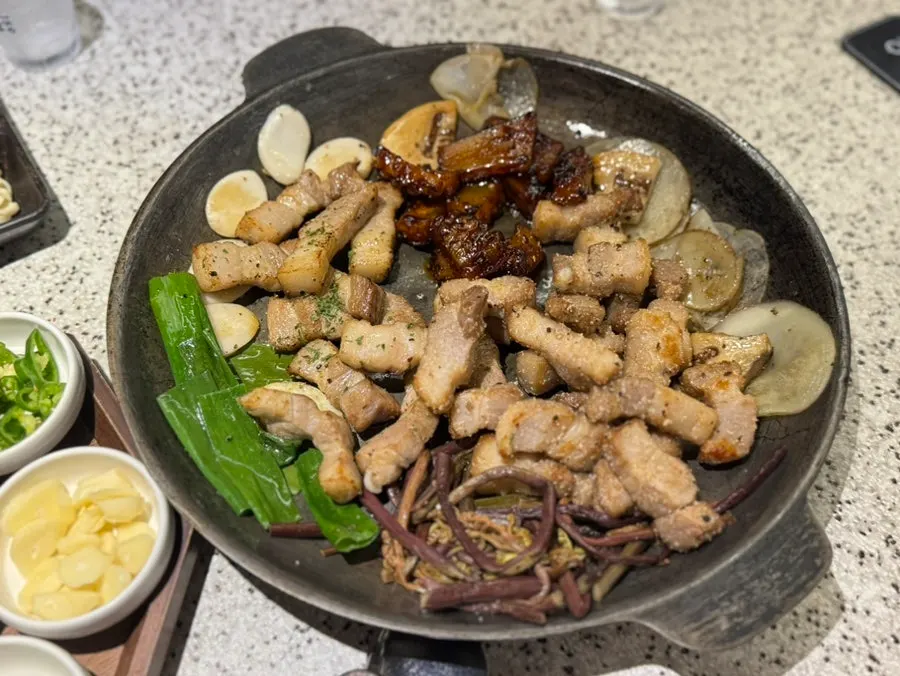 A generously full table set with meat
