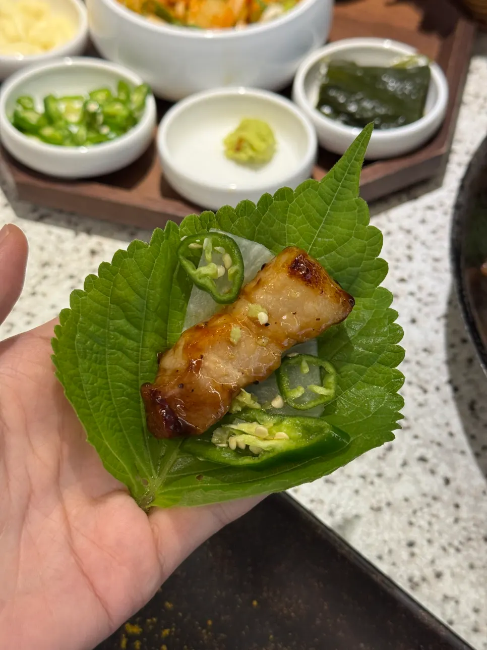 Thick-cut aged pork belly served already grilled