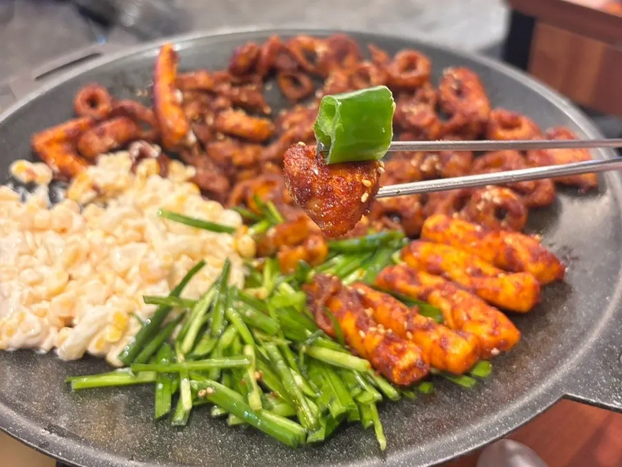 Perilla leaves, pickled radish, vinegar-chili sauce, and crunchy peppers served alongside