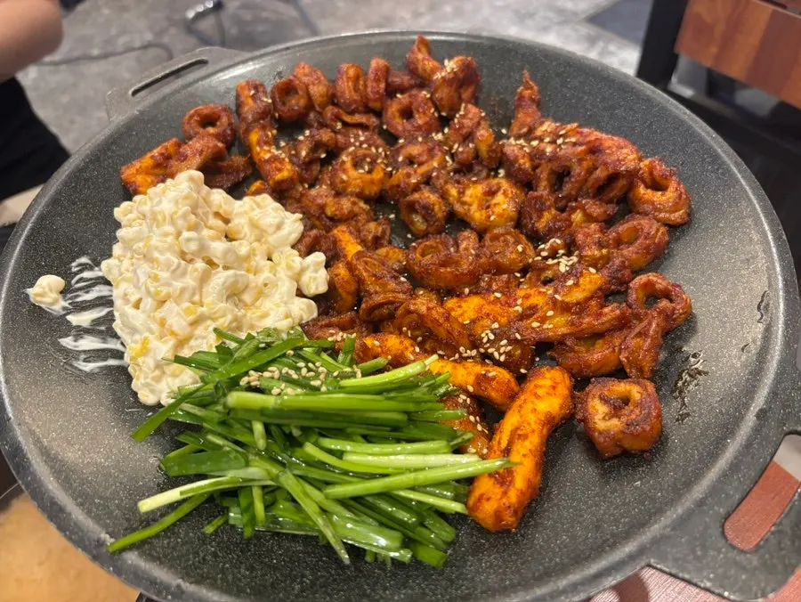 Two servings of seasoned makchang piled on the grill