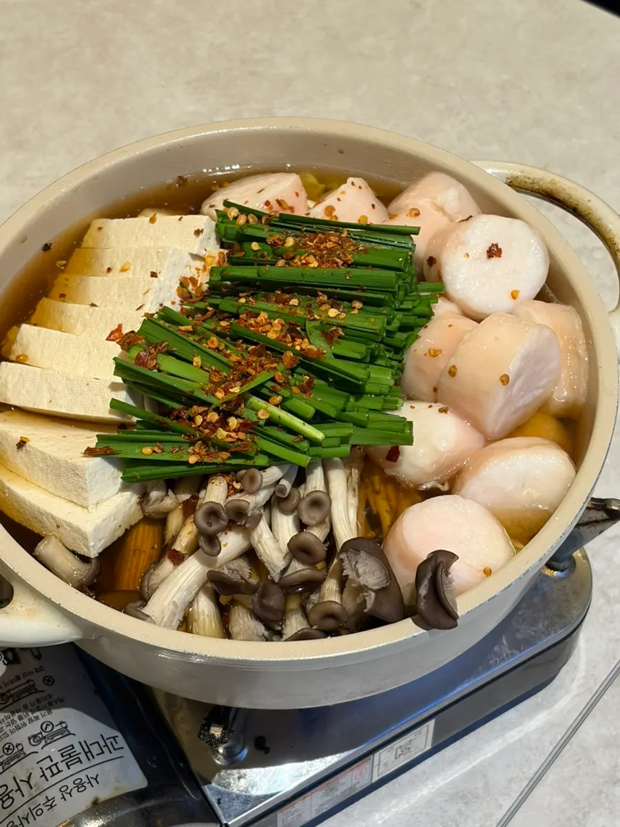 Daechang nabe served with beef intestine, mushrooms, and tofu