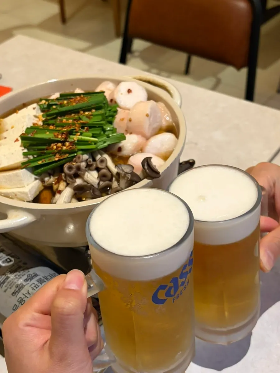 Two glasses of slushy draft beer with daechang nabe