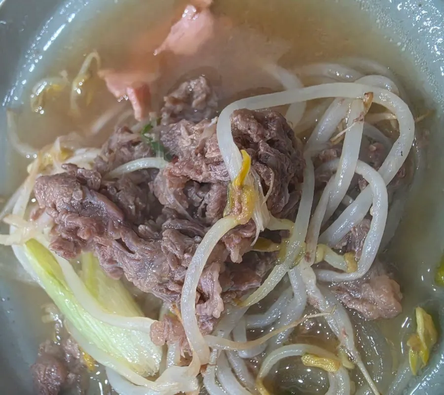 Glass noodles cooking alongside the beef bulgogi