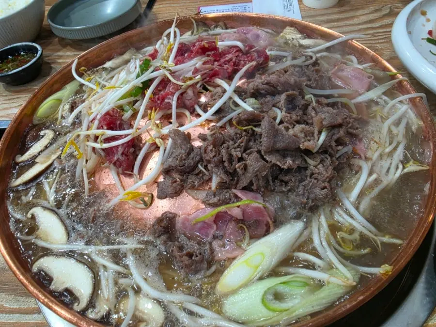 Full table spread of beef bulgogi and side dishes