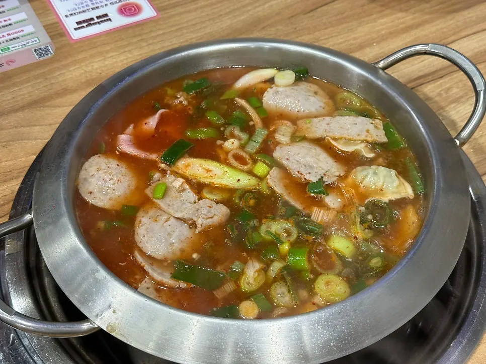Glass noodles and vegetables simmered in broth under the grill plate