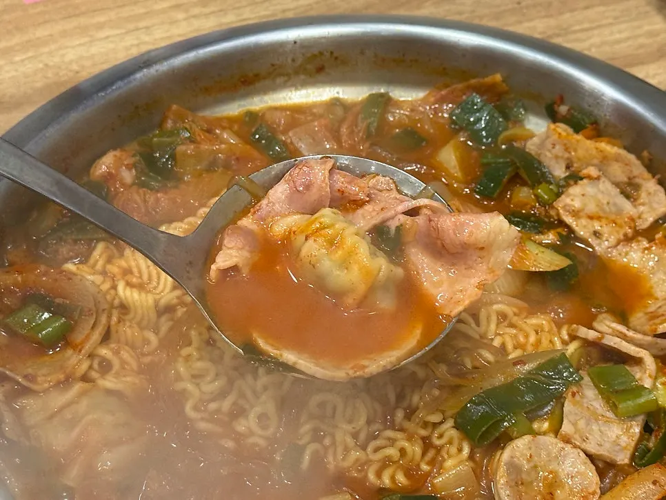 Gorae jeongtong kkot budae jjigae bubbling away