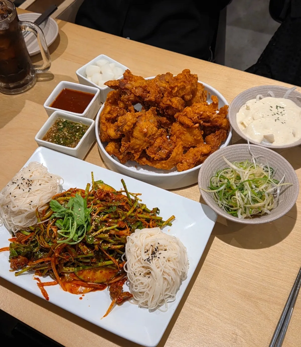 A full table of ordered dishes at Gorae Byeoljang Suji Branch