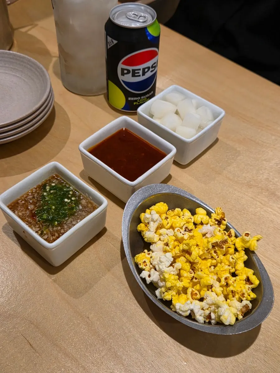 Close-up of boneless chicken topped with onion sauce