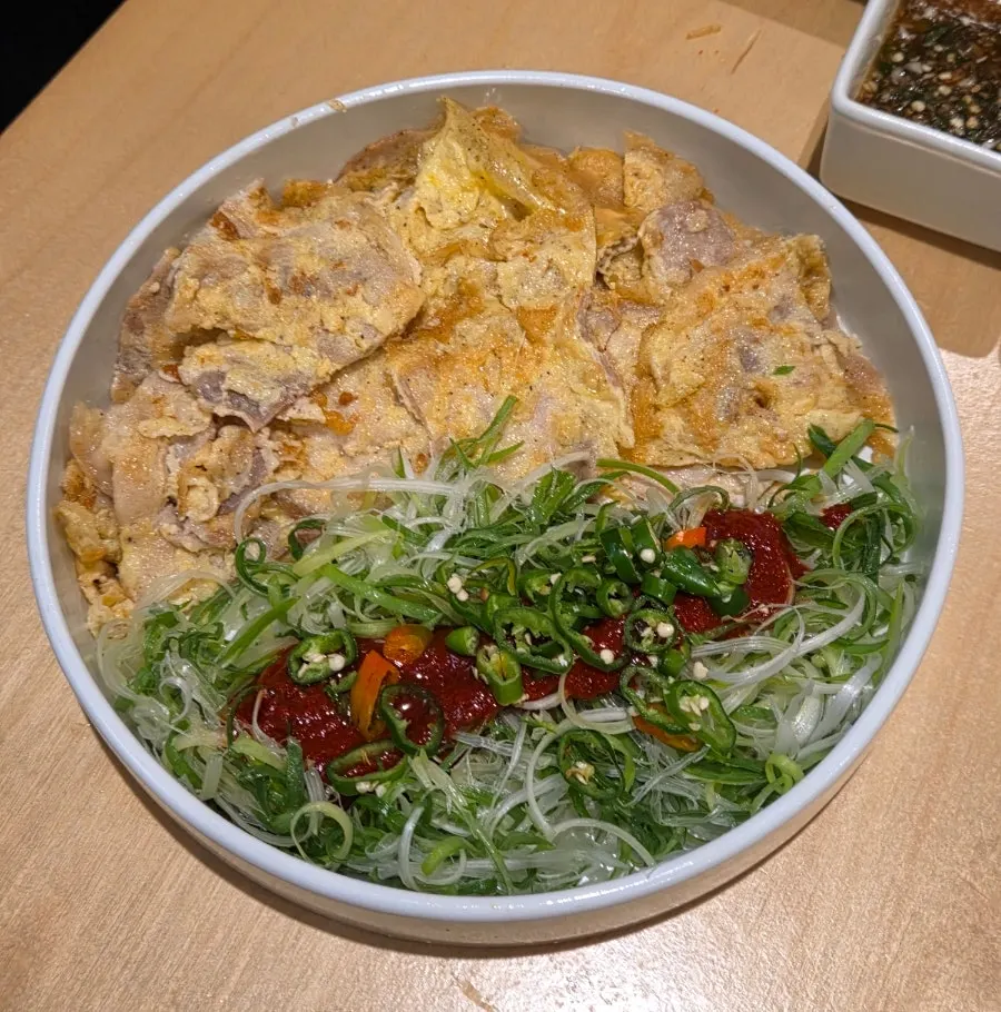 Jeonju-style pork jeon topped with scallion salad