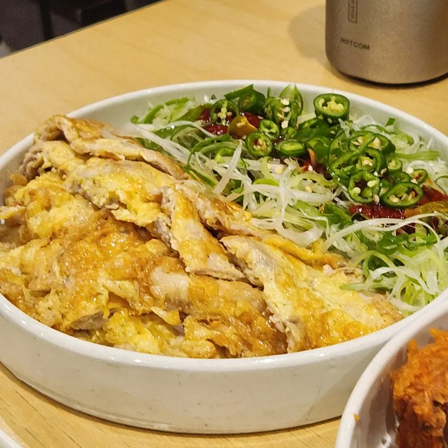 Table set with chicken, tteokbokki, and yukjeon all together