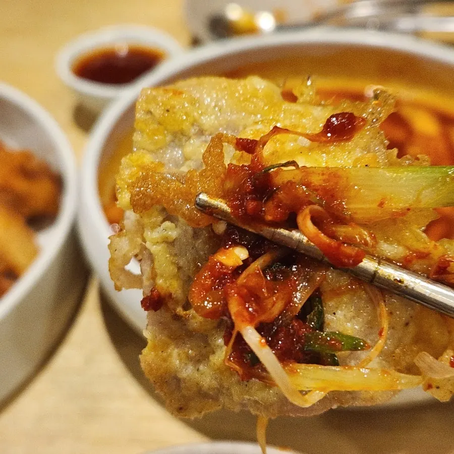 Pork yukjeon topped with shredded scallion