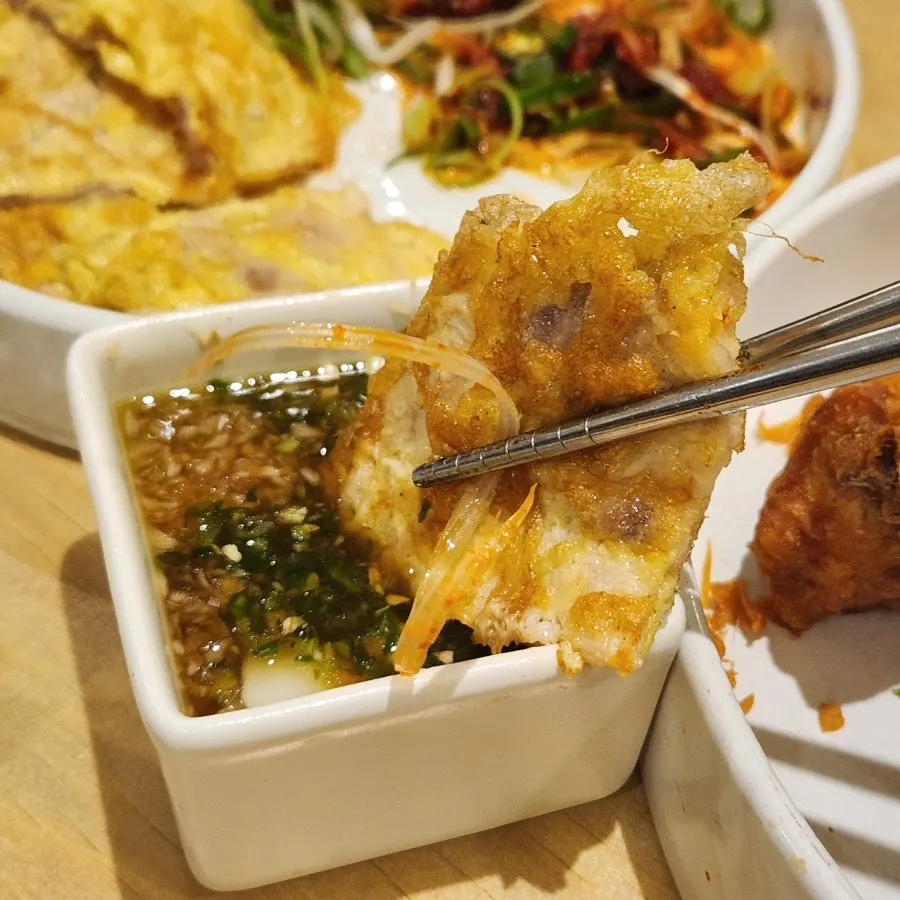 Pork yukjeon dipped in garlic sauce