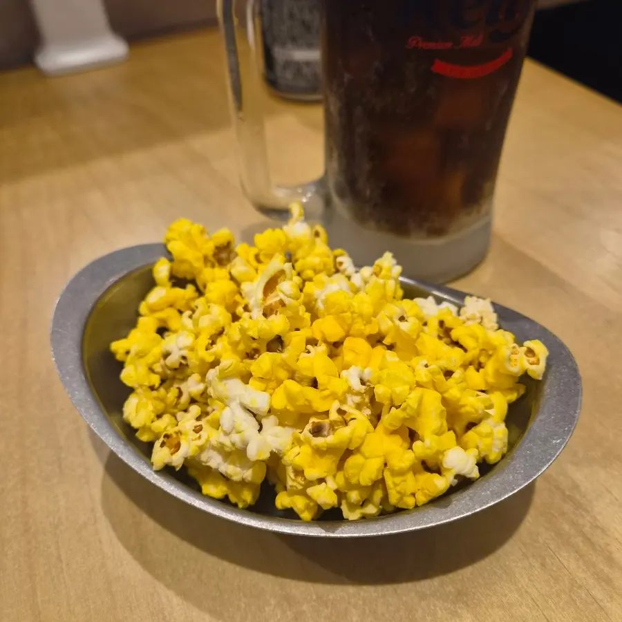 Self-serve popcorn being scooped