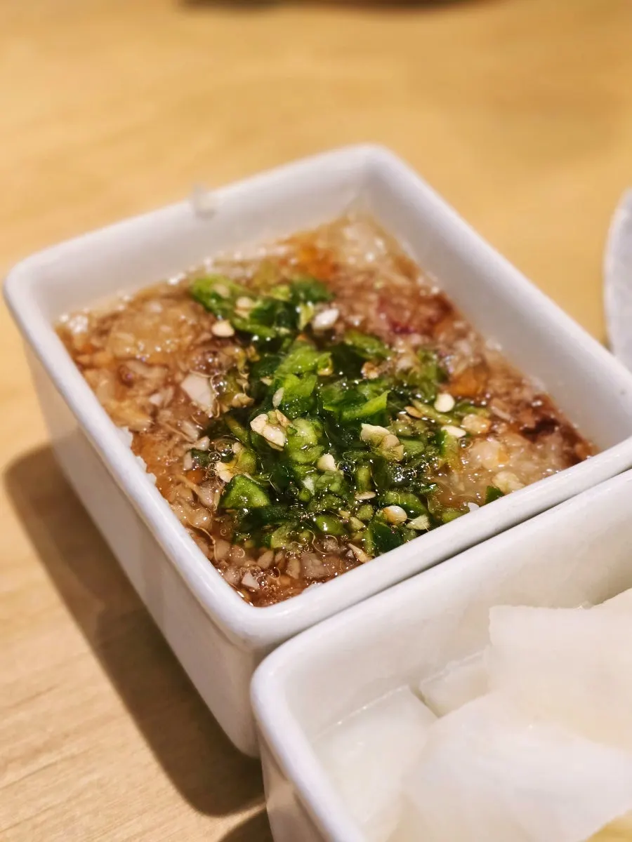 Soy sauce served with the chicken