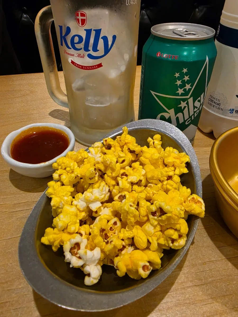 Table with popcorn, chicken radish, and the special sauce