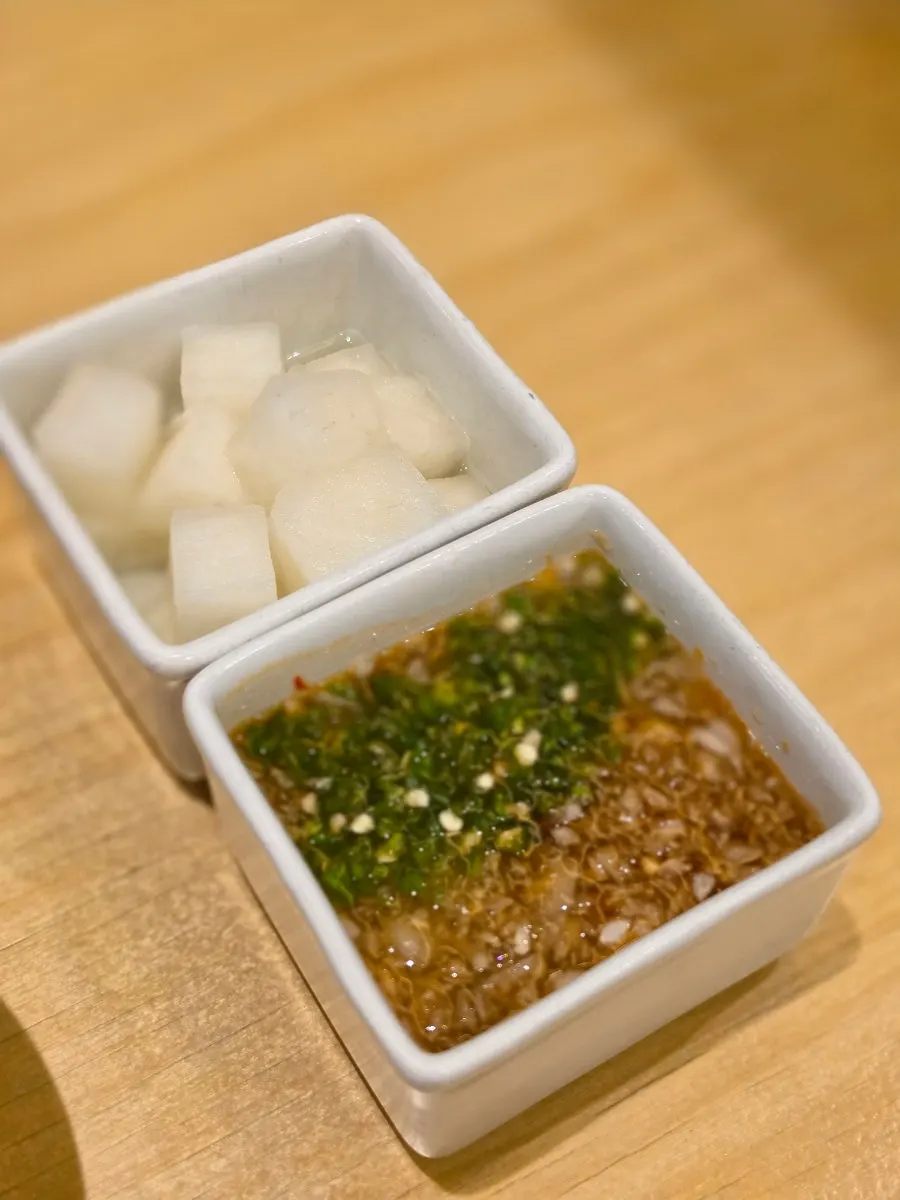 Plate of radish and special sauce served with the chicken