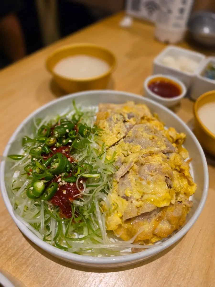 Jeonju-style pork jeon served with spring onion shreds