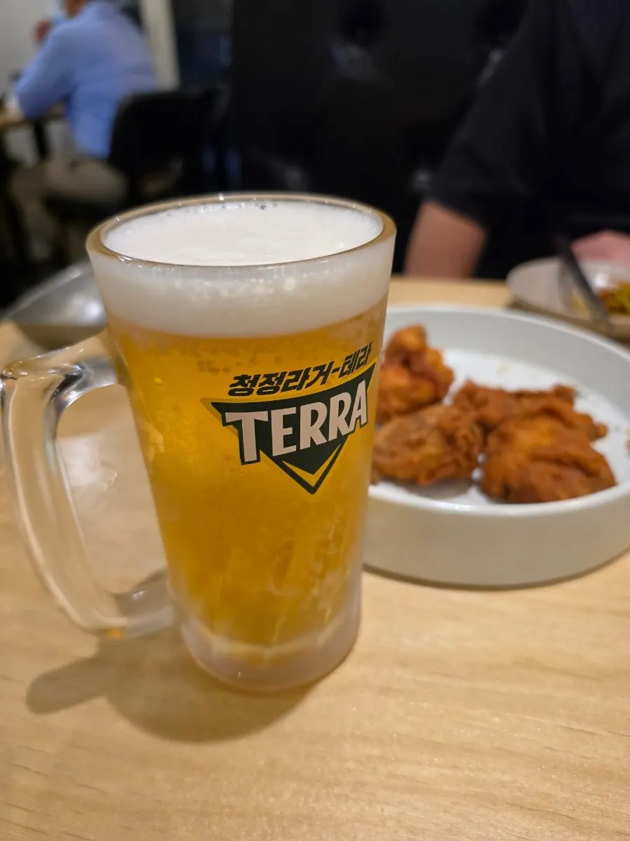 A glass of draft beer enjoyed alongside the chicken