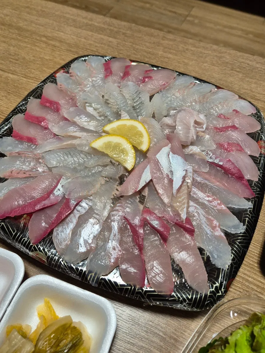 Mixed sashimi platter set up in the hotel room, packed from Bongpo Hoega