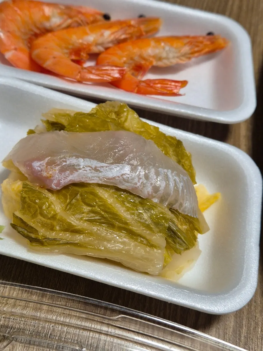 Picking up a firm, chewy piece of sashimi