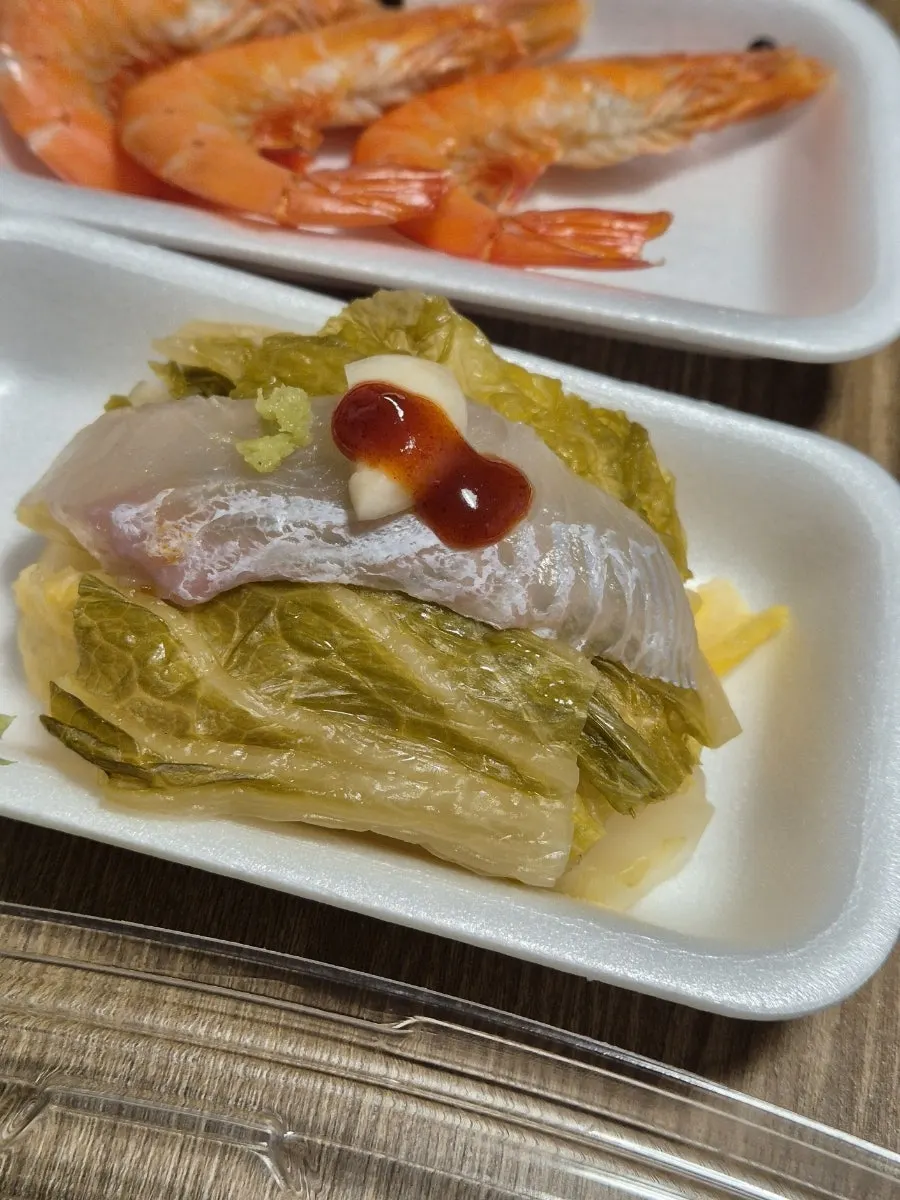 Sashimi wrapped in aged kimchi