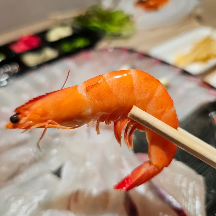 Seasonal assorted sashimi with shrimp, aged kimchi, and lettuce for wraps